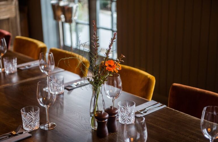 Private dining room table laid up for an event in a pub located in Cobham, Surrey.